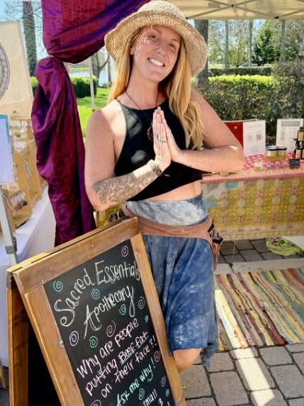 Amanda at the Sacred Essentials apothecary stand